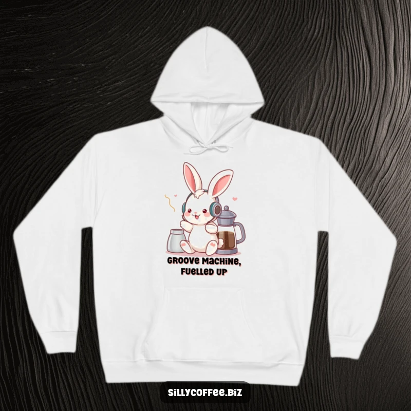 Funny hoodie showcasing a kawaii bunny with headphones, grooving happily beside a coffee pot, embodying a chill musical vibe.